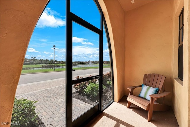 11758 Izarra Way Unit 7703, Fort Myers, FL 33912 - sunroom / solarium featuring a water view
