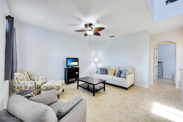 11758 Izarra Way Unit 7703, Fort Myers, FL 33912 - living room with arched walkways and a ceiling fan