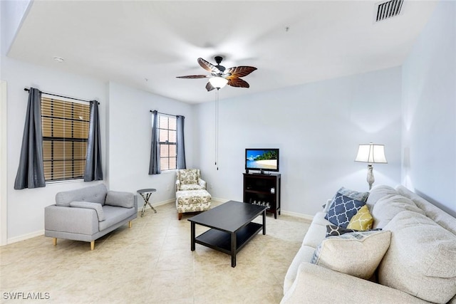 11758 Izarra Way Unit 7703, Fort Myers, FL 33912 - living room featuring a ceiling fan and baseboards