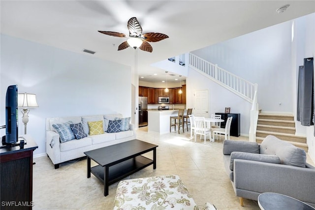 11758 Izarra Way Unit 7703, Fort Myers, FL 33912 - living room with stairway, ceiling fan, light tile patterned flooring, and recessed lighting
