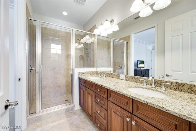 11758 Izarra Way Unit 7703, Fort Myers, FL 33912 - full bathroom featuring a chandelier, double vanity, a shower stall, and tile patterned flooring