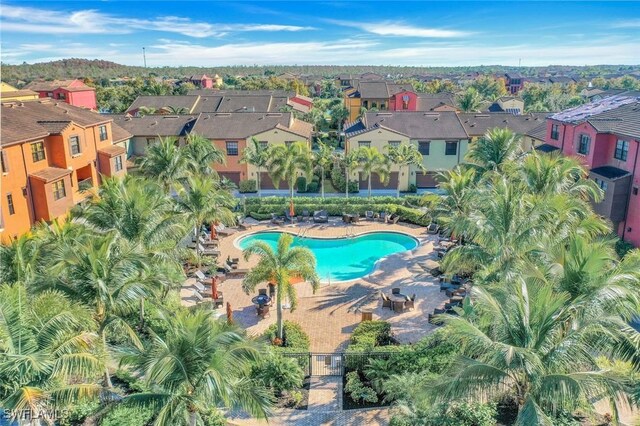 11758 Izarra Way Unit 7703, Fort Myers, FL 33912 - aerial view of property and surrounding area featuring nearby suburban area and a pool area