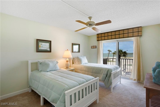 25710 Hickory Blvd Unit A 202, Bonita Springs, FL 34134 - carpeted bedroom featuring access to outside, a textured ceiling, and a ceiling fan