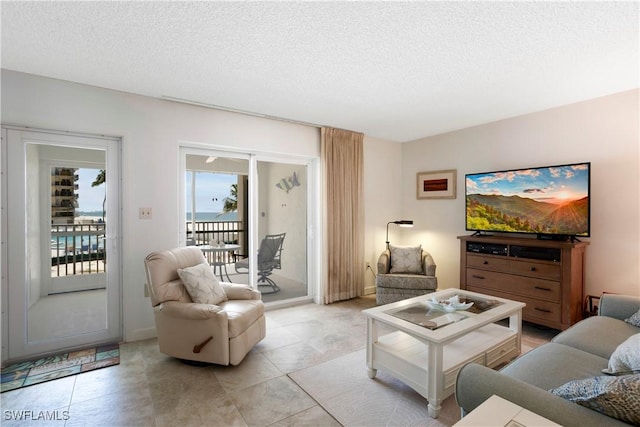 25710 Hickory Blvd Unit A 202, Bonita Springs, FL 34134 - living area with a textured ceiling