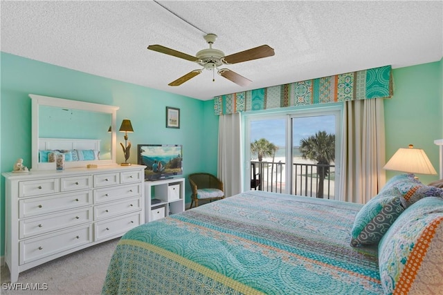 25710 Hickory Blvd Unit A 202, Bonita Springs, FL 34134 - bedroom featuring access to outside, carpet flooring, a textured ceiling, and ceiling fan