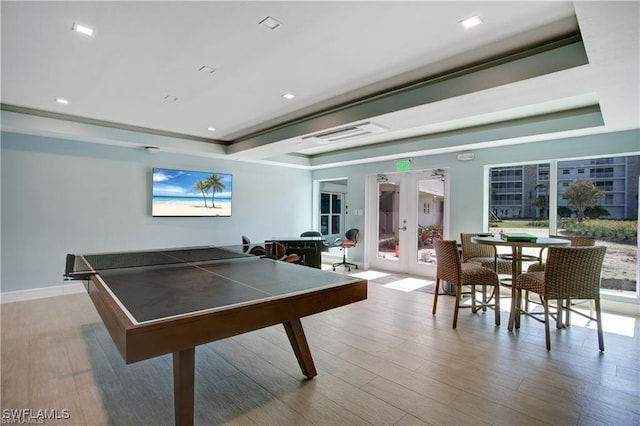 25710 Hickory Blvd Unit A 202, Bonita Springs, FL 34134 - game room featuring french doors, wood finished floors, a raised ceiling, and recessed lighting