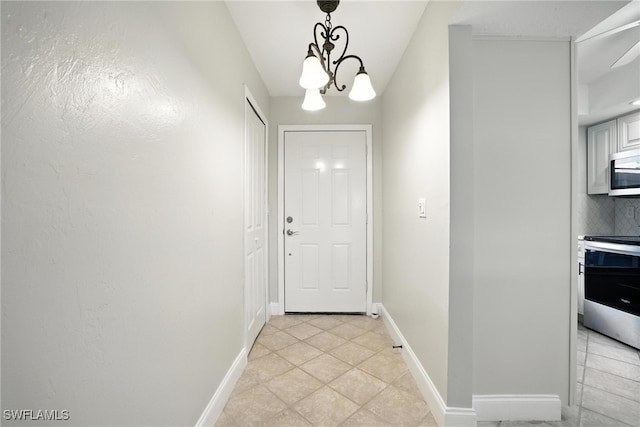 16001 Dublin Cir Unit 103, Fort Myers, FL 33908 - entryway featuring light tile patterned floors and a chandelier