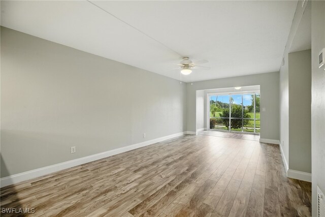 16001 Dublin Cir Unit 103, Fort Myers, FL 33908 - unfurnished room featuring a ceiling fan and wood finished floors