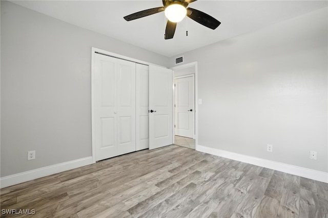 16001 Dublin Cir Unit 103, Fort Myers, FL 33908 - unfurnished bedroom with light wood-type flooring, a closet, and ceiling fan