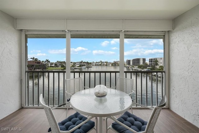 10682 Gulf Shore Dr Unit C302, Naples, FL 34108 - sunroom with a water view and plenty of natural light