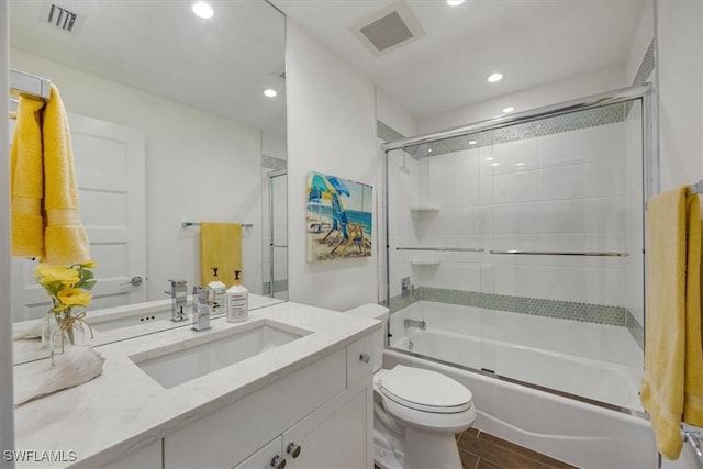10682 Gulf Shore Dr Unit C302, Naples, FL 34108 - full bathroom featuring vanity, shower / bath combination with glass door, recessed lighting, and wood finished floors