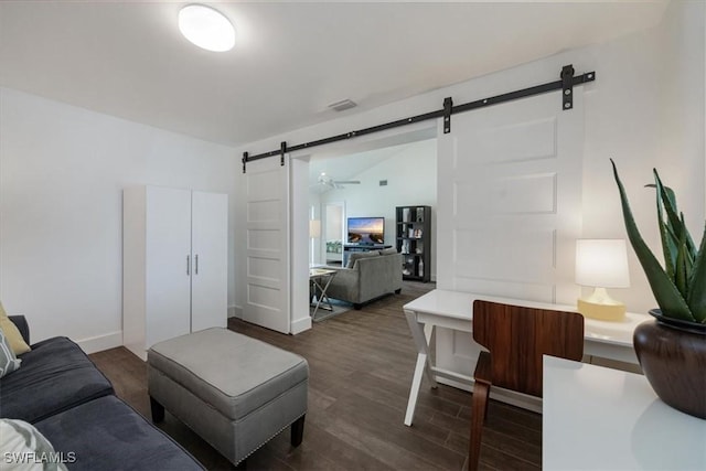 10682 Gulf Shore Dr Unit C302, Naples, FL 34108 - living room featuring a barn door and dark wood-style flooring