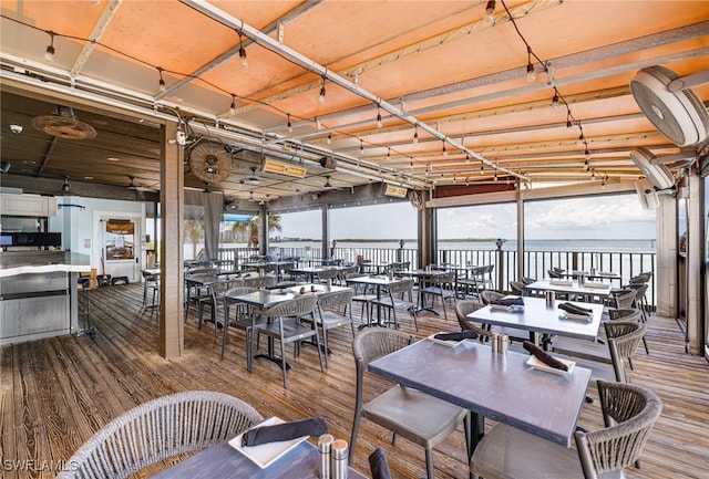 8771 Estero Blvd Unit 607, Fort Myers Beach, FL 33931 - wooden deck with a water view and outdoor dining space