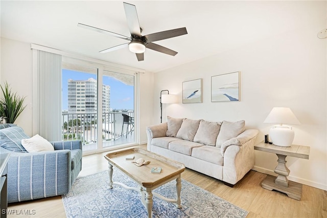 8771 Estero Blvd Unit 607, Fort Myers Beach, FL 33931 - living area with a ceiling fan, wood finished floors, and a city view