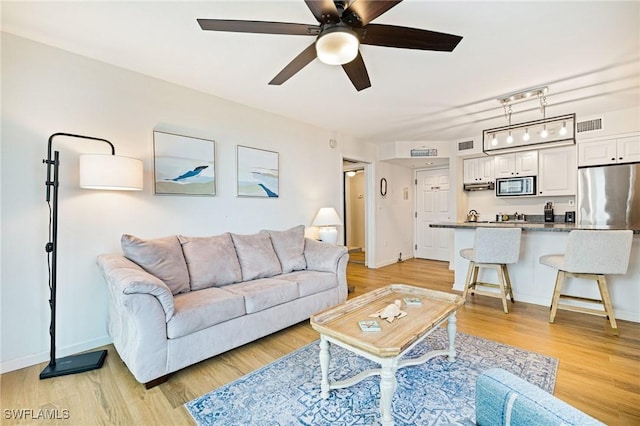 8771 Estero Blvd Unit 607, Fort Myers Beach, FL 33931 - living area with a ceiling fan and light wood finished floors