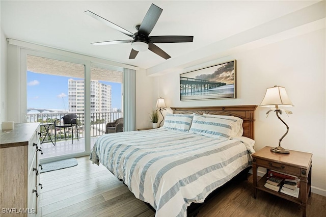 8771 Estero Blvd Unit 607, Fort Myers Beach, FL 33931 - bedroom with access to outside, wood finished floors, ceiling fan, expansive windows, and a view of city