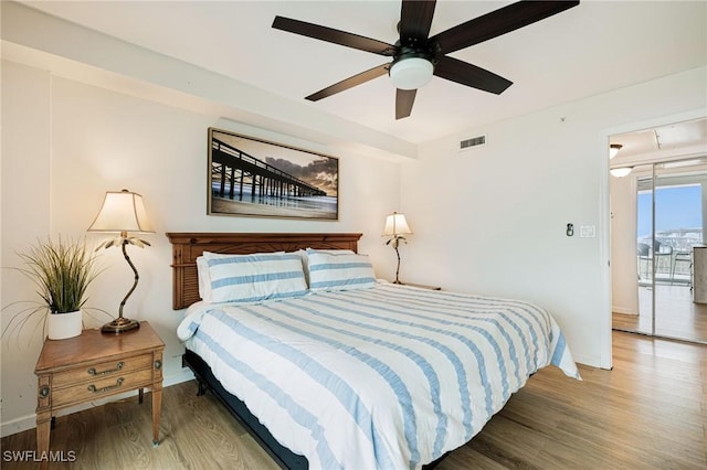 8771 Estero Blvd Unit 607, Fort Myers Beach, FL 33931 - bedroom with wood finished floors and ceiling fan