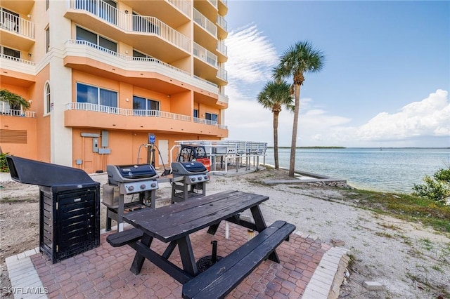 8771 Estero Blvd Unit 607, Fort Myers Beach, FL 33931 - view of patio / terrace with a water view and area for grilling