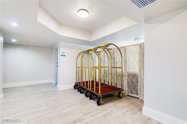 8771 Estero Blvd Unit 607, Fort Myers Beach, FL 33931 - hallway with wood finished floors and a tray ceiling