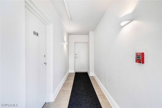 8771 Estero Blvd Unit 607, Fort Myers Beach, FL 33931 - hall featuring dark speckled floor and baseboards