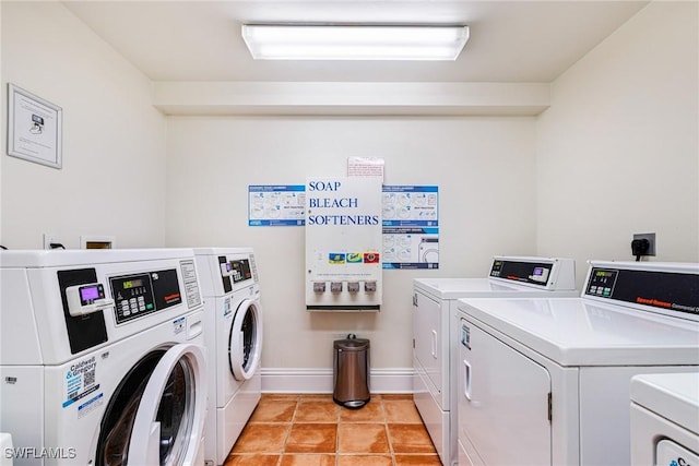 8771 Estero Blvd Unit 607, Fort Myers Beach, FL 33931 - communal laundry room with washer and clothes dryer and light tile patterned floors