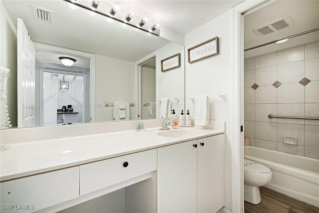 8771 Estero Blvd Unit 607, Fort Myers Beach, FL 33931 - full bathroom with vanity, wood finished floors, and shower / tub combination