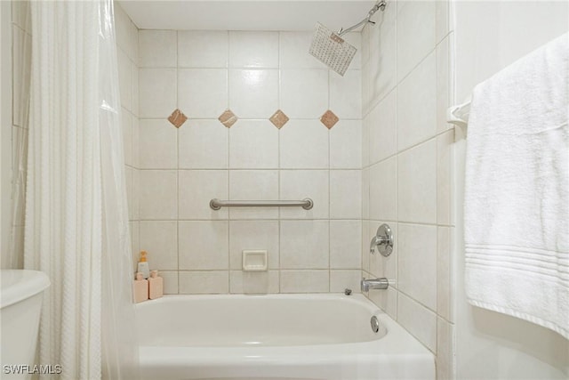 8771 Estero Blvd Unit 607, Fort Myers Beach, FL 33931 - bathroom featuring shower / bathtub combination with curtain and toilet