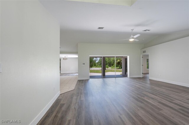 2790 Randall Blvd, Naples, FL 34120 - unfurnished living room with ceiling fan, dark wood-style flooring, and vaulted ceiling