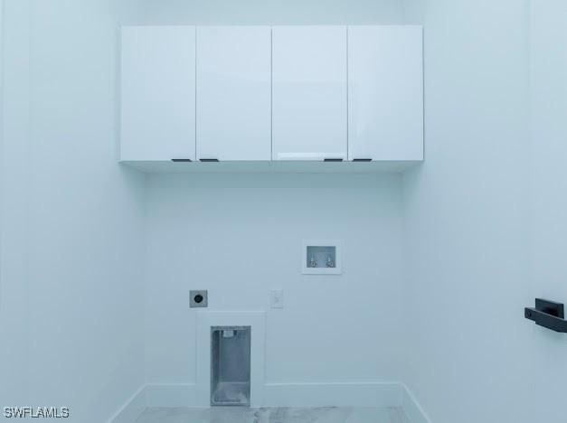 3103 13th St SW, Lehigh Acres, FL 33976 - laundry room with washer hookup, electric dryer hookup, and cabinet space