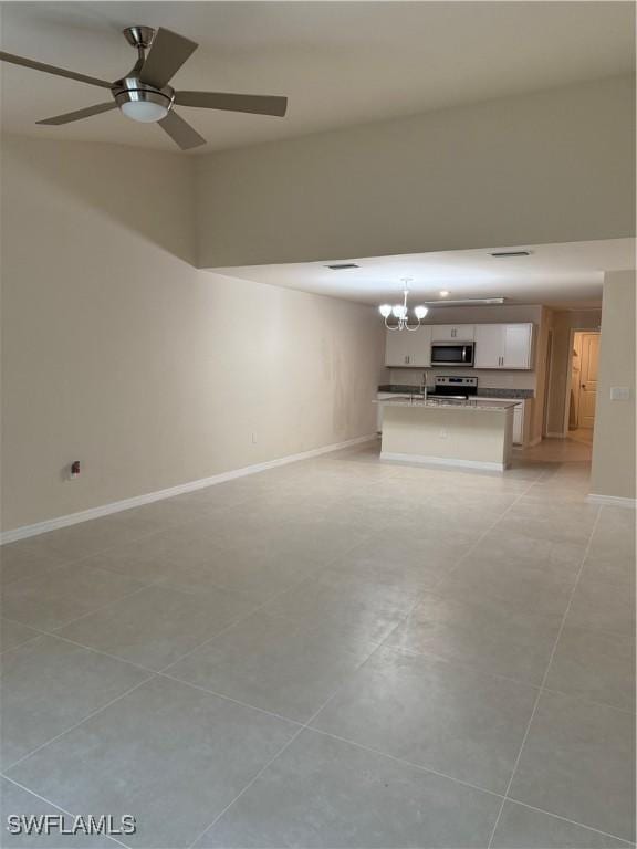 9069 Aegean Cir, Lehigh Acres, FL 33936 - unfurnished living room with a chandelier, a ceiling fan, and light tile patterned floors