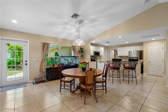 873 Spaulding St E, Lehigh Acres, FL 33974 - dining room with lofted ceiling, light tile patterned flooring, and recessed lighting
