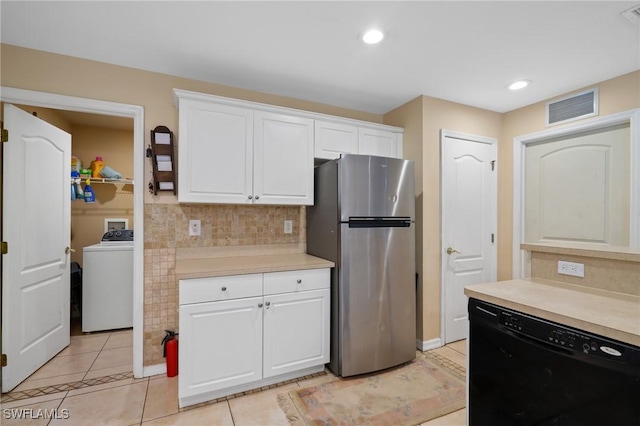 873 Spaulding St E, Lehigh Acres, FL 33974 - kitchen featuring washer / dryer, freestanding refrigerator, dishwasher, light countertops, and white cabinets