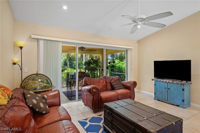 873 Spaulding St E, Lehigh Acres, FL 33974 - living area with light tile patterned floors, a ceiling fan, and vaulted ceiling