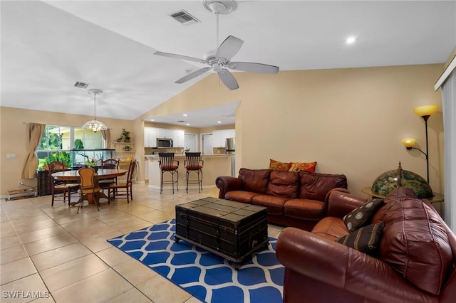 873 Spaulding St E, Lehigh Acres, FL 33974 - living area featuring light tile patterned floors, lofted ceiling, and ceiling fan