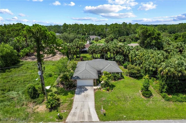 873 Spaulding St E, Lehigh Acres, FL 33974 - view from above of property with a forest