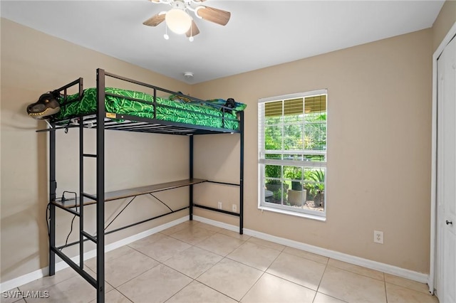 873 Spaulding St E, Lehigh Acres, FL 33974 - unfurnished bedroom featuring light tile patterned floors and a closet