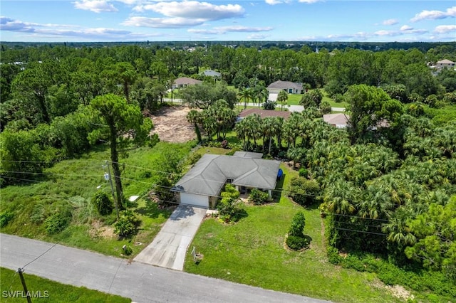 873 Spaulding St E, Lehigh Acres, FL 33974 - aerial view of a heavily wooded area