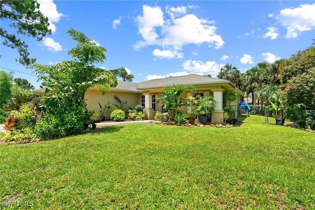 873 Spaulding St E, Lehigh Acres, FL 33974 - back of property featuring stucco siding