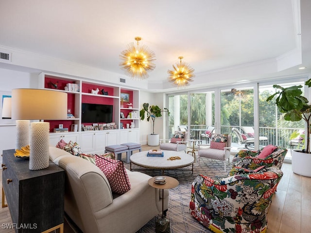 8440 Abbington Cir Unit D22, Naples, FL 34108 - living area with wood-type flooring, a chandelier, and crown molding