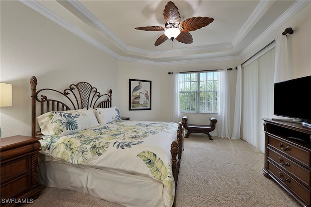 4844 Hampshire Ct Unit 305, Naples, FL 34112 - bedroom with a tray ceiling, light colored carpet, ornamental molding, and ceiling fan
