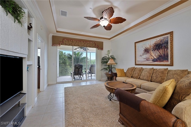 4844 Hampshire Ct Unit 305, Naples, FL 34112 - living area with a tray ceiling, light tile patterned floors, ceiling fan, and crown molding