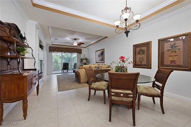 4844 Hampshire Ct Unit 305, Naples, FL 34112 - dining room featuring a tray ceiling, ornamental molding, ceiling fan, and a chandelier
