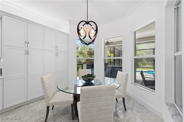 28617 Sicily Loop, Bonita Springs, FL 34135 - dining space featuring light marble finish flooring, a chandelier, and a ceiling fan