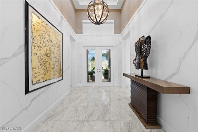 28617 Sicily Loop, Bonita Springs, FL 34135 - hall with french doors, a chandelier, and light marble finish flooring