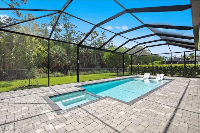 28617 Sicily Loop, Bonita Springs, FL 34135 - view of pool featuring a pool with connected hot tub, a patio, a yard, and glass enclosure