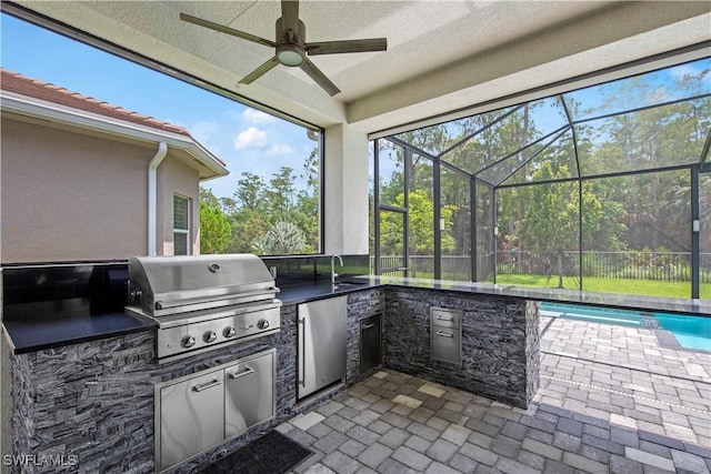 28617 Sicily Loop, Bonita Springs, FL 34135 - view of patio / terrace featuring exterior kitchen, a ceiling fan, and glass enclosure