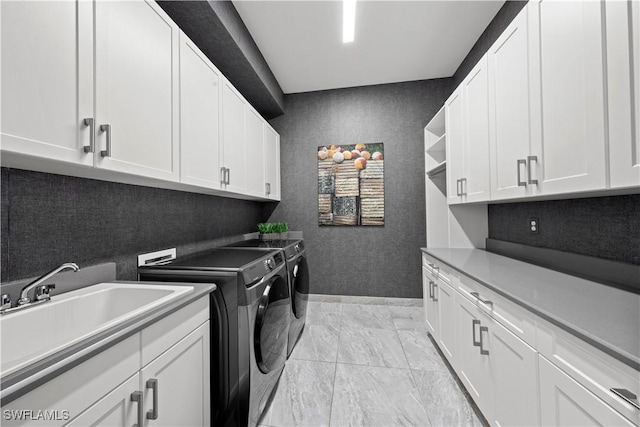 28617 Sicily Loop, Bonita Springs, FL 34135 - washroom featuring cabinet space, separate washer and dryer, and light marble finish flooring