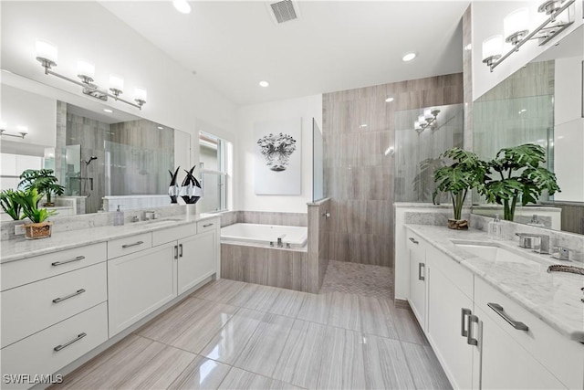 28617 Sicily Loop, Bonita Springs, FL 34135 - bathroom with a walk in shower, a bath, two vanities, tile patterned floors, and recessed lighting
