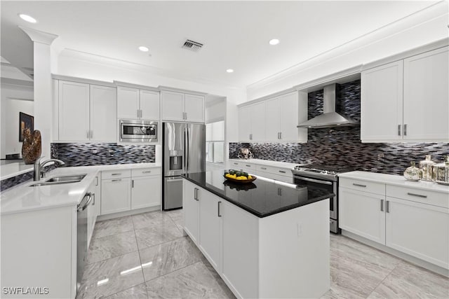 28617 Sicily Loop, Bonita Springs, FL 34135 - kitchen with wall chimney exhaust hood, appliances with stainless steel finishes, recessed lighting, tasteful backsplash, and light marble finish flooring