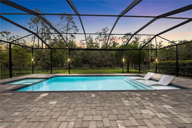28617 Sicily Loop, Bonita Springs, FL 34135 - view of swimming pool featuring a patio, a pool with connected hot tub, and glass enclosure